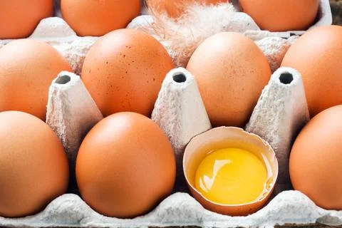 Brown raw eggs in the original packaging. Close up 写真素材