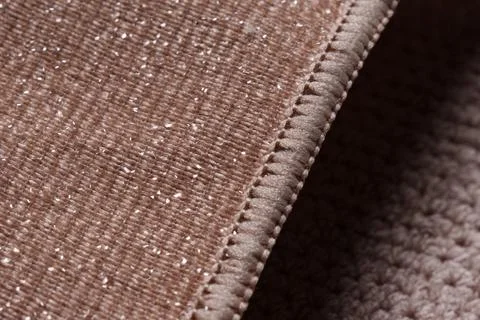 Brown reusable microfiber cloth for cleaning. Housework and housekeeping. Stock Photos
