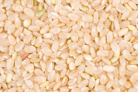 Brown rice as background Фото