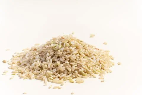 Brown rice isolated on white Stock Photos