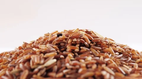 Brown rice rotating on white background Stock Footage 103239580