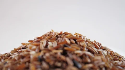 Brown rice rotating on white background Stock Footage 103401769