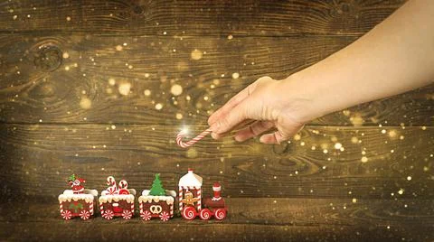 Brown rich wooden background from horizontal planks.Christmas toy train on a Foto stock