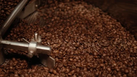 Brown roasted coffee beans are being mixed. Stock Footage 108101294