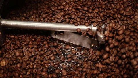 Brown roasted coffee beans are being mixed. Stock Footage 108101565