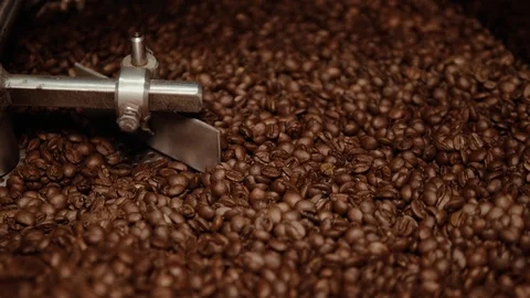Brown roasted coffee beans are being mixed. Stock Footage 108101871