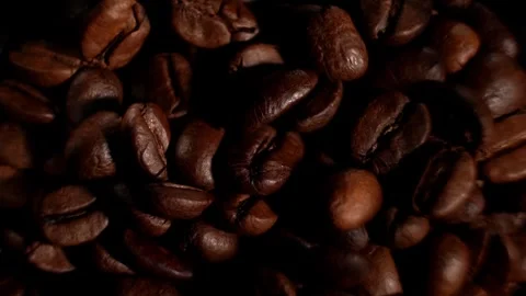 Brown roasted coffee beans. Camera rotation. Stock Footage 300446012