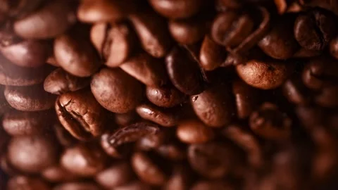 Brown roasted coffee beans. Close up of seeds of coffee. Dark Coffee Grains. Video stock 151119120