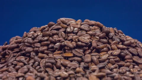 Brown roasted coffee beans, seed on dark blue background. Close up rotation 스톡 동영상 89856001