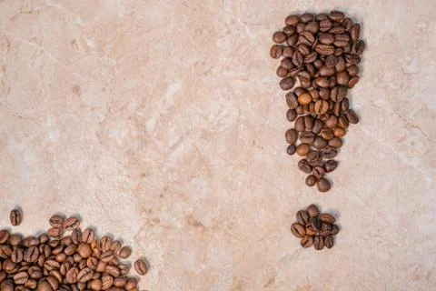 Brown roasted coffee beans in the shape of an exclamation mark Stock Photos