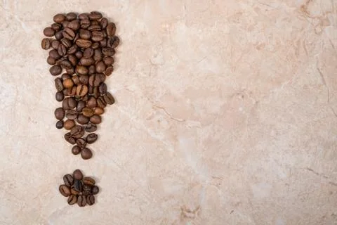 Brown roasted coffee beans in the shape of an exclamation mark Stock Photos