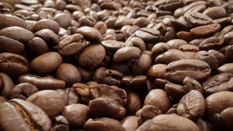 Brown roasted coffee beans. Slider dolly shot. Pile of tasty coffee beans Stock Footage 303281358