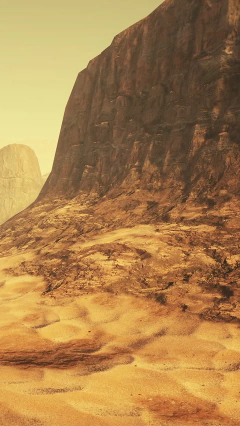 Brown rock formation with sandy ground in a dry landscape near a mountain range Stock Footage 341270479