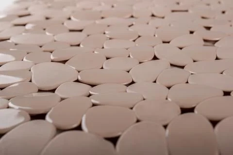 Brown rubber mat for bath with pattern as background, imitation of river ston Stock-Fotos