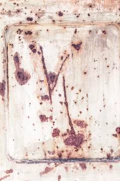 Brown rust on a white door Stock Photos