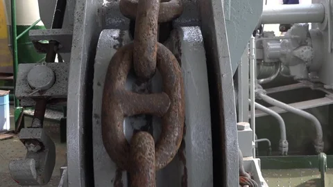 Brown rusty anchor chain moves down with snaps close Stock Footage 113454770