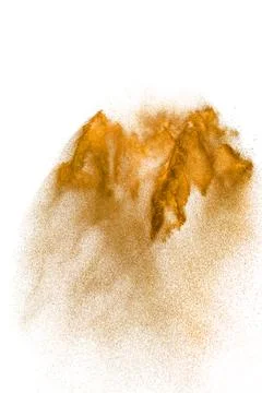 Brown sand explosion isolated on white background. Abstract sand cloud back.. Stock Photos