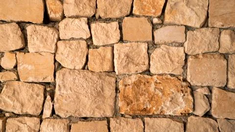 Brown sand stone texture, wall surface of old building Fotos de archivo