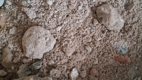 Brown sandy soil texture moving in a slow motion video clip 스톡 동영상 339335060