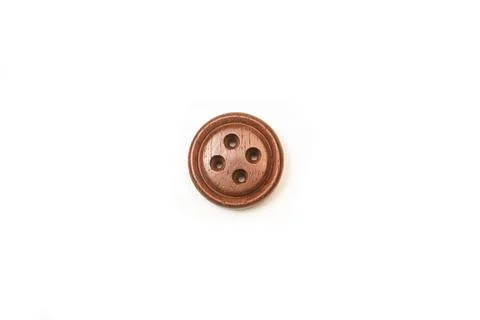 Brown sewing button on a white background with copy space Stock Photos