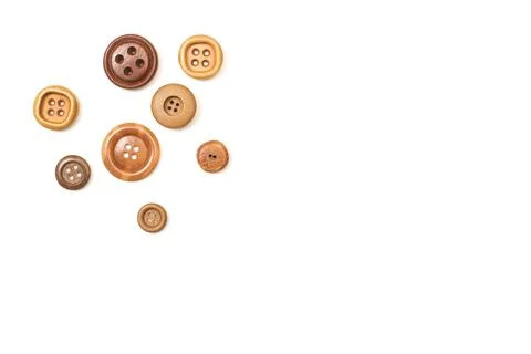 Brown sewing buttons on a white background with copy space Foto stock