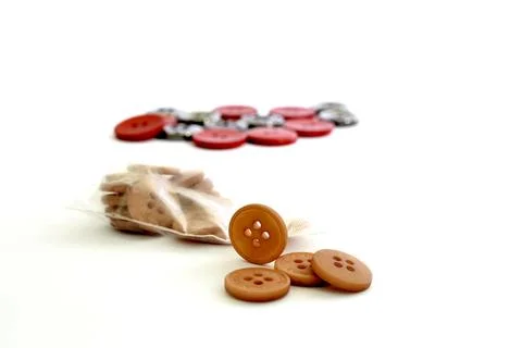Brown sewings button on white background Stock Photos