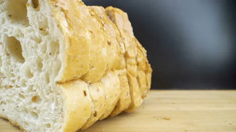 The brown side of the sliced loaf bread Stock Footage 135694294
