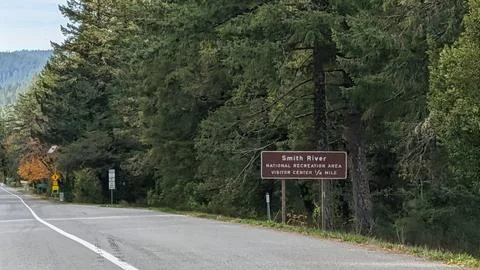 A brown sign marks the Smith River National Recreation Area visitor center Stock Photos
