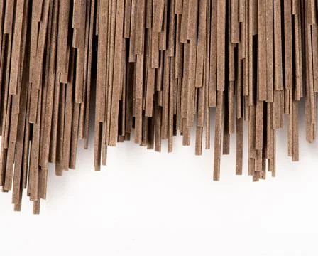 Brown spaghetti isolated on white background Stock Photos