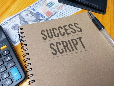 Brown spiral notebook with Success Script text on a wooden desk with a calc.. Stock Photos