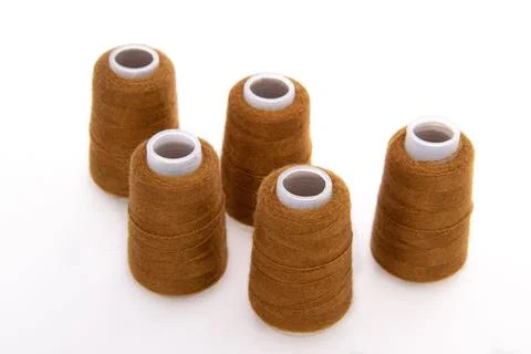 Brown spool of thread isolated on white background. Skein of woolen threads Stock Photos