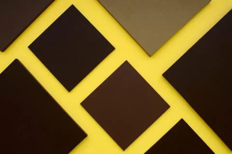 Brown square box on yellow background Foto stock