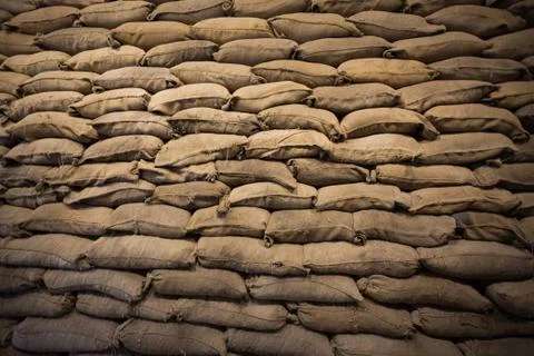 Brown stack of rice sacks pattern background Stock Photos