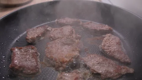Brown Steaks Grilling in Pan. Stock Footage 255251727