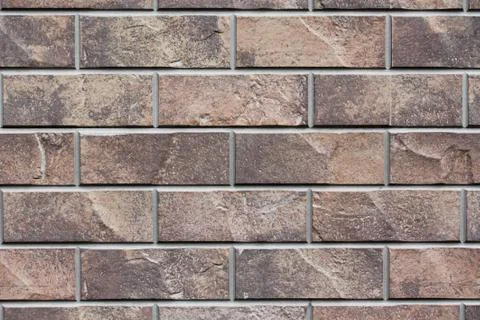 Brown stone siding tile wall abstract background Stock Photos
