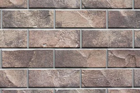 Brown stone siding tile wall abstract background Stock Photos