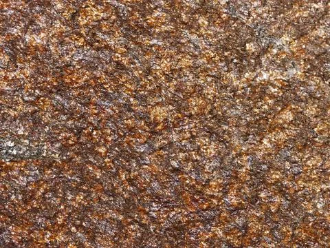 Brown stone texture of the granite bed for a natural background Stock Photos
