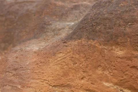 Brown stone texture with sandy close-up inclusions Stock Photos