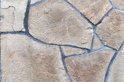 Brown stone wall, background, texture, rectangular natural stones of differen Foto stock