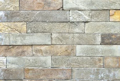 Brown stone wall, background, texture, rectangular natural stones of differen 스톡 사진