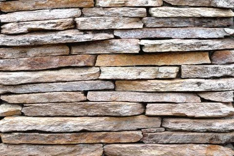 Brown stone wall, background, texture Stock Photos