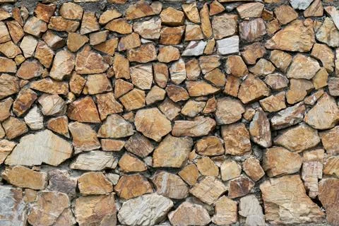 Brown stone wall. Stock Photos