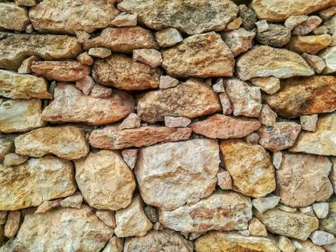 Brown stone wall Stock Photos