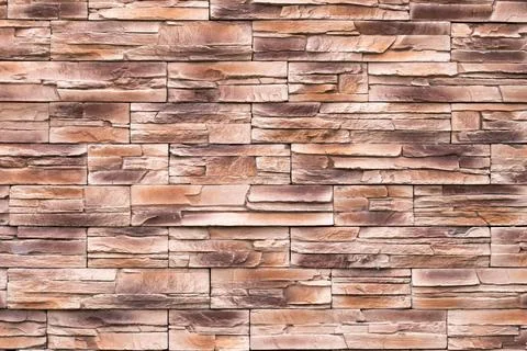 Brown stone wall texture, uneven surface, grunge brick background, abstract p Stock Photos