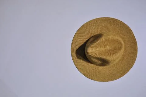 Brown straw hat on a white table Stock Photos