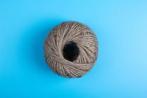 Brown string on blue background Stock Photos