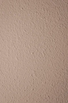 Brown structural painted wallpaper on the wall Stock Photos