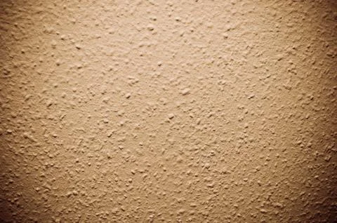 Brown structural painted wallpaper on the wall Stock Photos