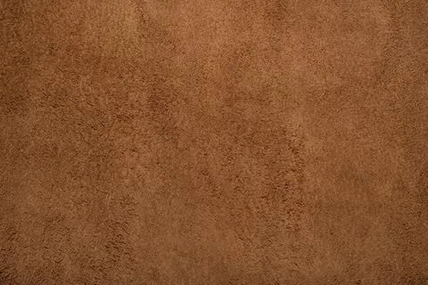 Brown suede leather texture background, genuine leather, top view. Stock Photos