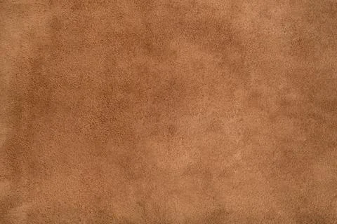 Brown suede leather texture background, genuine leather, top view. Stock Photos
